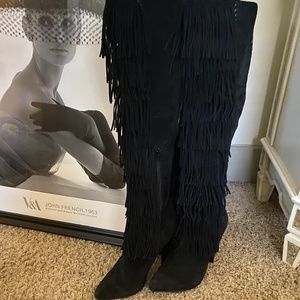 Over the knee fringe boots